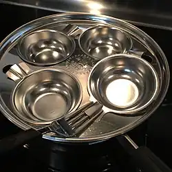 Revere Ware 8" 1488 Breakfast Unit with four removable stainless steel cups. Note the "lock on" cup handles, designed to accept any household fork