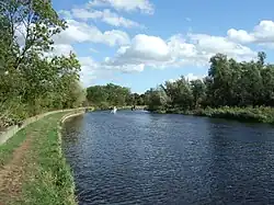 Boats navigating the River Soar near Sutton Bonington - the left towpath side is Nottinghamshire, with Leicestershire to the right.