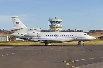 A twin-jet, high-tailplane passenger aircraft painted white above and grey below