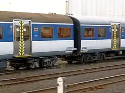 Two SA cars, showing re-used (left) and new (right) bogies on 4 February 2010