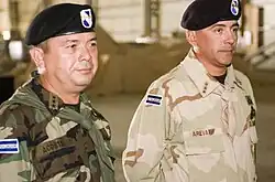 A photograph of Salvadoran colonels Walter Mauricio Arévalo Gavidia and César Adonai Acosta Bonilla in military camouflage uniform