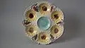 Oyster plate, 9.6 in, coloured glazes, c. 1881, sunflower pattern
