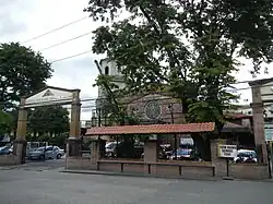 The view of the church façade behind the trees