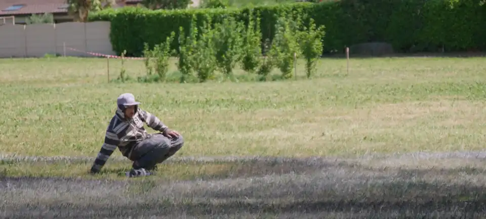 Saype (Guillaume Legros) at work for the ArtiChoke festival, 2019