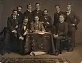 A circa 1890 group portrait of Scottish architects, including William Fraser, ARIBA, standing, center. Private Collection.