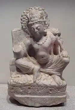 Seated Avalokiteshvara, white marble, Khair Khaneh, 6th-7th century CE. Musée Guimet MA 8151.[12]