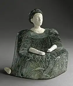 Female figurine of the "Bactrian princess" type; 2500–1500; chlorite (dress and headdresses) and limestone (head, hands and a leg); height: 13.33&nbsp;cm; Los Angeles County Museum of Art (USA)