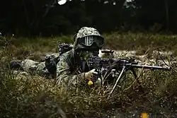 A Singaporean soldier with a deployed Ultimax 100 Mk 2 Section Automatic Weapon (SAW)