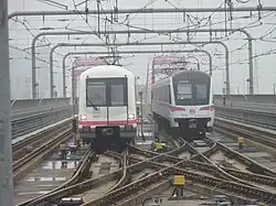 06C01 train on the left and 06C02 train on the right