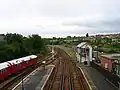 Looking south from the station's old footbridge; the Island Line's signalbox is visible on the right