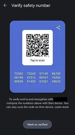 Screenshot of the Signal Android app showing a screen labelled "Verify safety number" with a QR code and a series of 60 digits. Below the digits is the note "To verify end-to-end encryption with [redacted], compare the numbers above with their device. You can also scan the code on their device. Learn more". Under the note is a button labelled "Mark as verified".