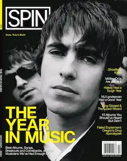 Cover of Spin Magazine with Liam Gallagher and Noel Gallagher of Oasis on the cover, the headline is on the lower left side titled THE YEAR IN MUSIC in bold yellow coloured typeface
