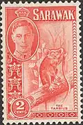 Postage stamp featuring the western tarsier and George VI (top left)