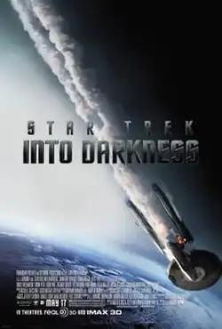 The poster shows the USS Enterprise falling towards Earth with smoke coming out of it. The middle of the poster shows the title written in dark gray letters, and the film's credits and the release date are shown at the bottom of the poster.