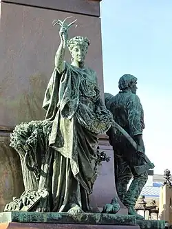 The sculpture Peace on the northern edge of the pedestal.