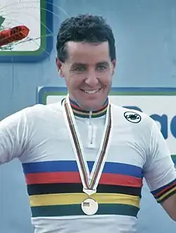 Stephen Roche wearing a jersey with rainbow stripes.