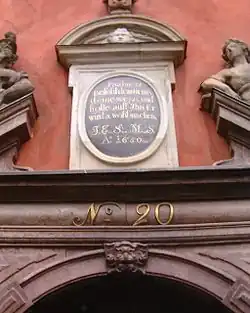 Inscription over the front door of 20 quoting Psalm 37:5 in German: "Befiehl dem Herrn deine Wege und hoffe auf ihn, er wirds wohl machen". English translation: "Commit thy way unto the Lord; trust also in Him, and He will bring it to pass."