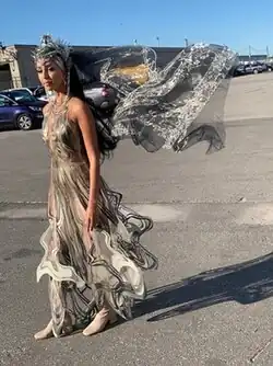 Picture of actress Gia Sandhu wearing an elaborate, layered-dress and headpiece