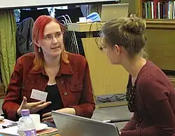 Suw Charman-Anderson speaking to a person.