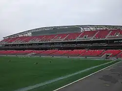 Photo of stadium grandstand with press box near the top