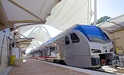 TEXRail Stadler FLIRT waiting on the platform