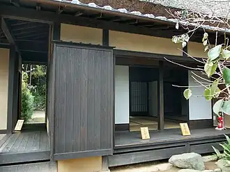 Left, an en running between buildings, joining them.