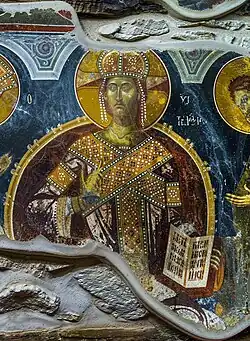 Depiction of Jesus in royal Byzantine robes; part of the Deesis. Next to him is his mother Mary wearing similar robing, John the Baptist, and two noblemen; one of them thought to be Andrea II Muzaka.