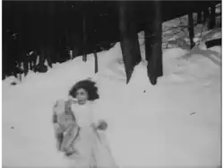 The girl running away with the teddy bear