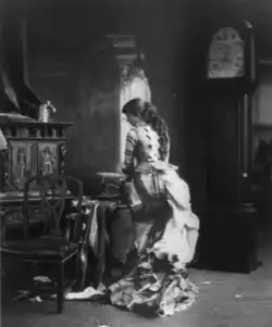 "Sarony's Centennial Tableaux", showing young woman making U.S. Flag on sewing machine, c. 1876