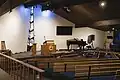 A view of the chancel and front half of the sanctuary of the UU Church of Boulder