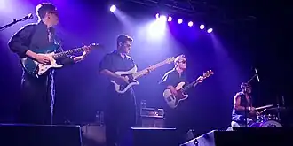 The Fearless Flyers quartet performing onstage in 2018