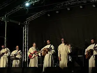 Six members of the band during a concert