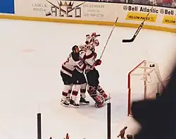 Teammates mob Martin Brodeur moments after the 1995 Stanley Cup Final