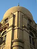 The building's style is a mix of European and Islamic motifs.