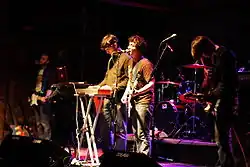 The Main Drag performing live in 2007. Photo by Kris Ireland. Left to right: Jon Carter, Dan Cardinal, Adam Arrigo, Maxi Boch. Not pictured: John Drake.