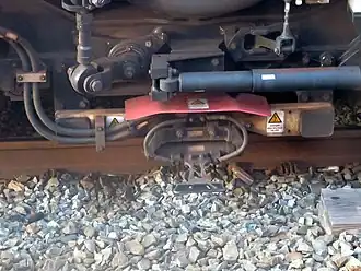 Contact shoe on Metro-North M8 railcar, designed for both over- and under-running third rail