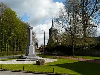 The war memorial and church in Thun-Saint-Martin