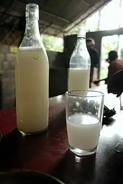 Image 5Palm wine is an alcoholic beverage created from the sap of various species of palm trees such as the palmyra, date palms, and coconut palms. It is known by various names in different regions and is common in various parts of Africa, the Caribbean, South America, South Asia, Southeast Asia, and Micronesia. (from List of national drinks)
