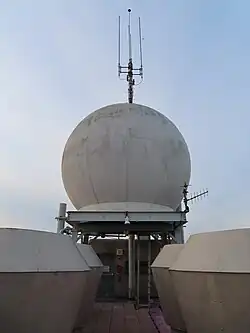 The roof's weather radar radome, a spherical device with antennas