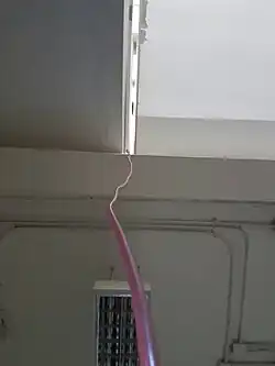 The photo is taken from upward angle while performing Torricelli's experiment.