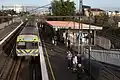 Westbound view of the now demolished station from the concourse, with a Comeng train arriving on Platform 1, September 2010
