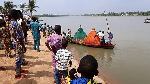 Two Zangbetos landing to the festival area.