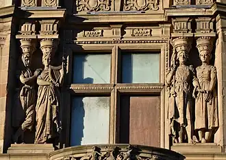 Two pairs of caryatids flanking first floor window, bay five, Princes Street façade