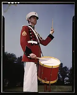 Charles Owen, a marimba soloist and timpanist, beating a drum at Marine Barracks Washington, May 1942