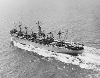 USS&nbsp;Altair underway in 1966. From the appearance of her decks and helicopter landing pad, aft, she is ready to commence an underway replenishment