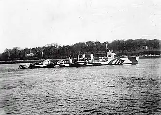 USS Fanning (DD-37), in port, probably at Queenstown, Ireland, after her 17 November 1917 fight with the German submarine U-58. She is painted in pattern camouflage.