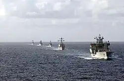 Wave Ruler (foreground), USS&nbsp;Mahan, Almirante Latorre, Sachsen, and USS&nbsp;Samuel B. Roberts navigate in formation.