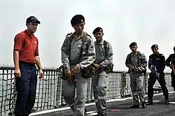 US Coast Guard directs Royal Brunei Navy personnel aboard USS Crommelin (FFG-37) during CARAT 2009.