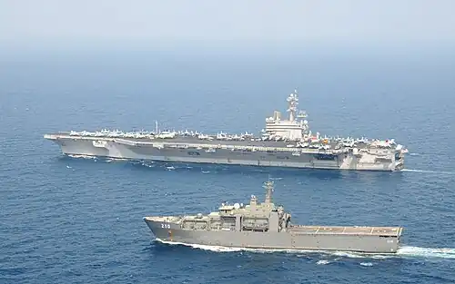 USS George H.W. Bush underway with RSS Endeavour in the Arabian Sea on 15 November 2011.