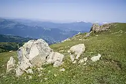 View of mountains with boulder in the foreground